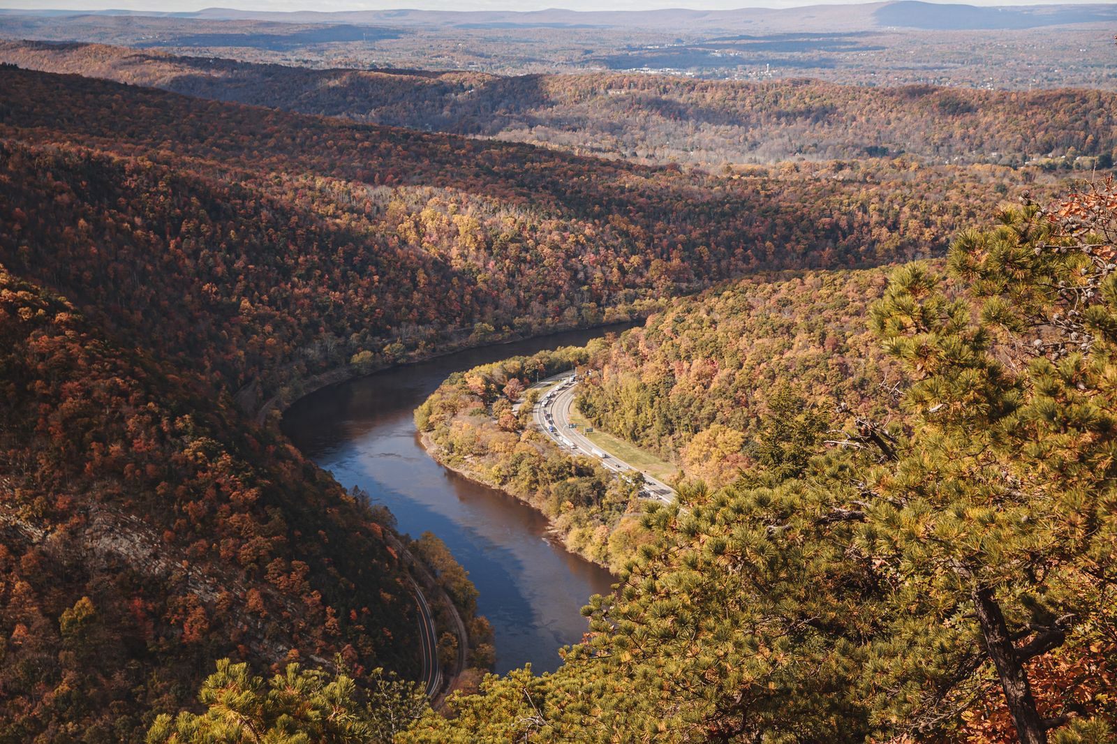 The Delaware River winding through the Water Gap between ridges in autumn color, a classic view for things to do in Pennsylvania in October